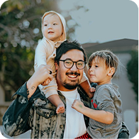 Family with young children representing museum family visitors